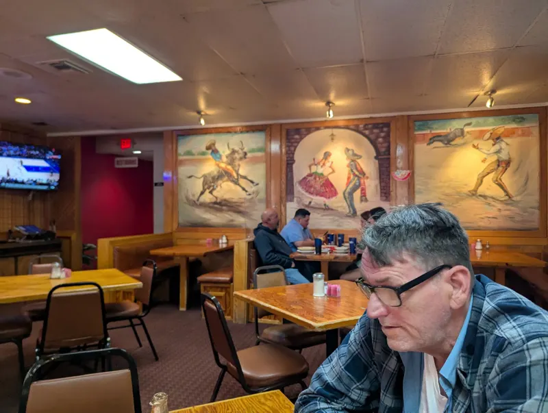 Dining room with hand painted bullfighter murals